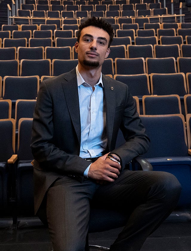 Brenden Peifer sits in a theater chair