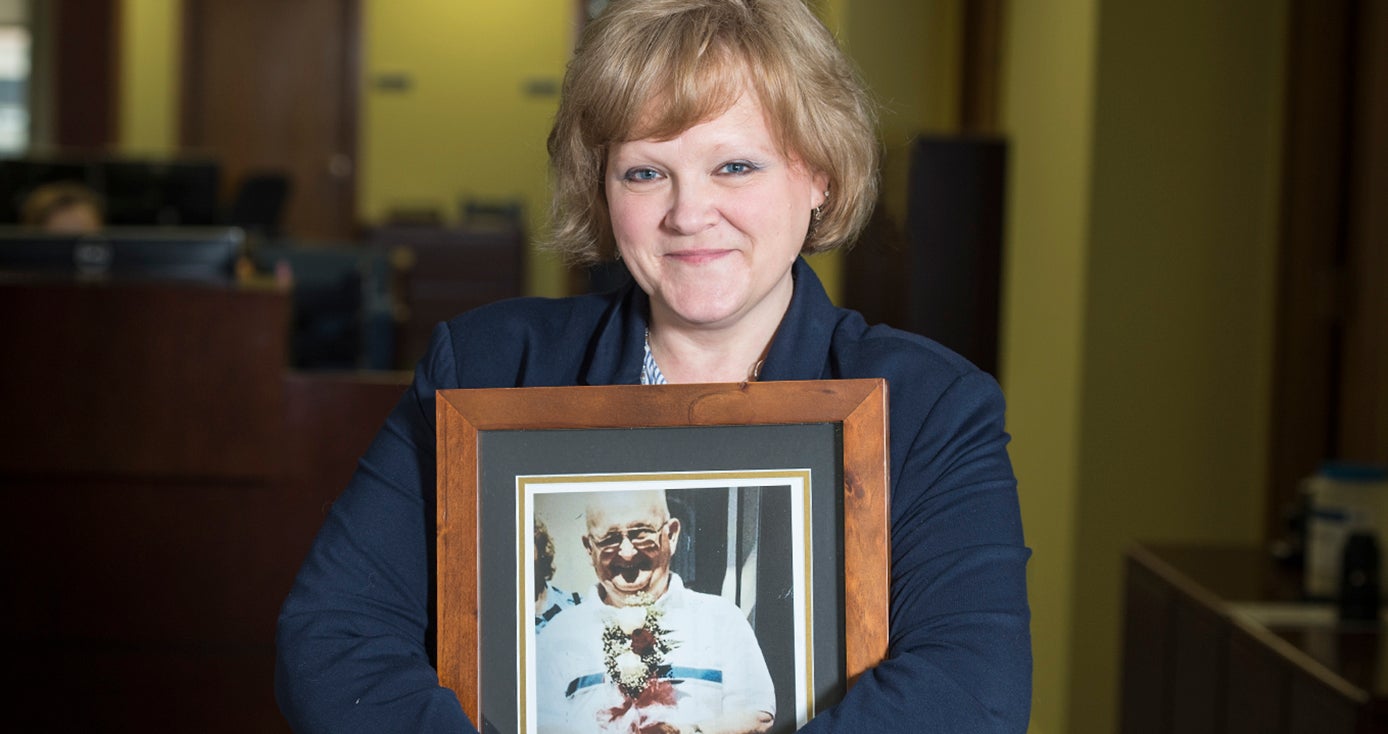 Wanda DiPaolo holds a photograph of her father