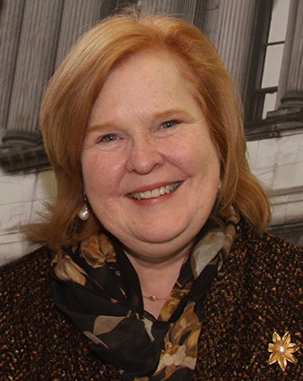 Kathleen Buechel in a dark patterned jacket