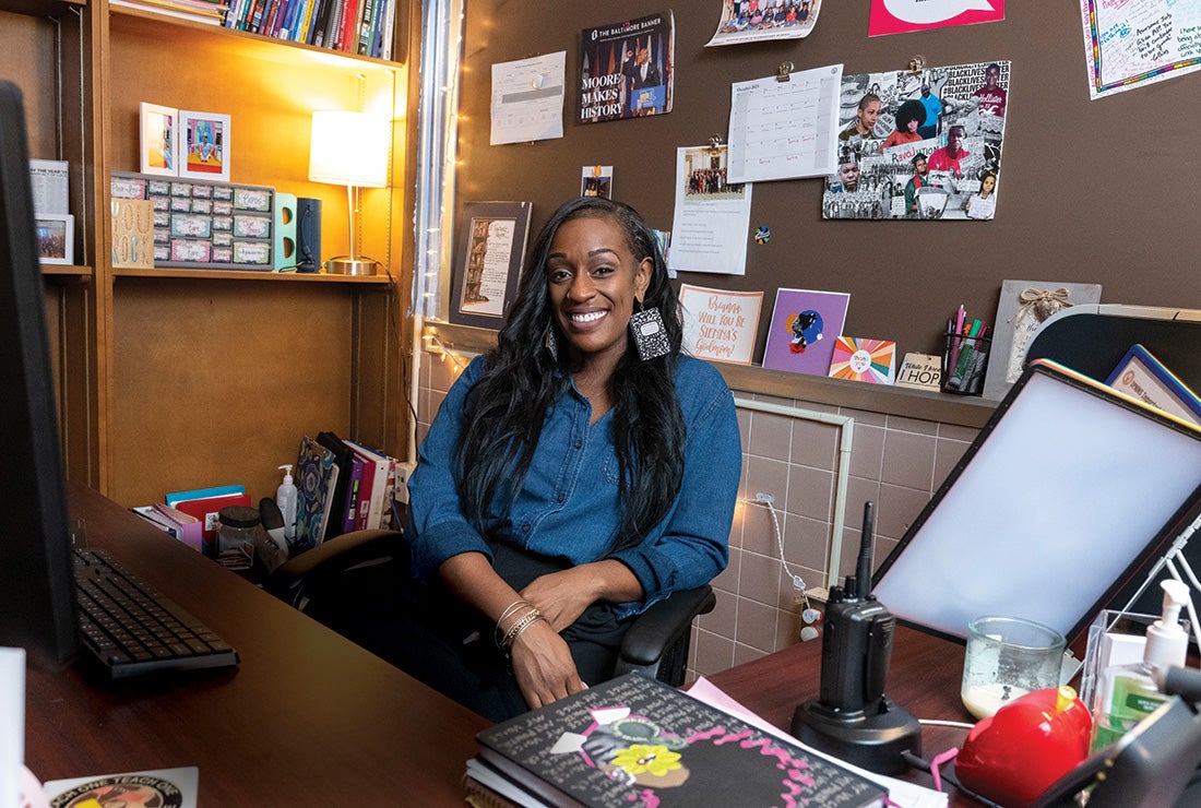 Brianna Ross sits in her office