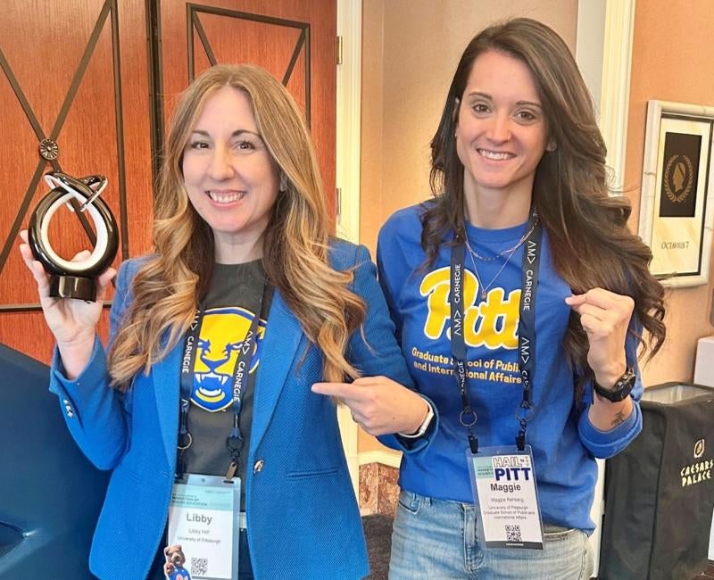 AMA award winners Libby Hilf and Maggie Rehberg pose in Pitt swag with their award