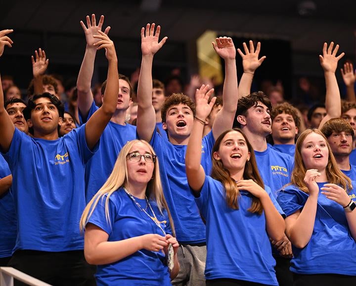 Students cheer at a pep rally