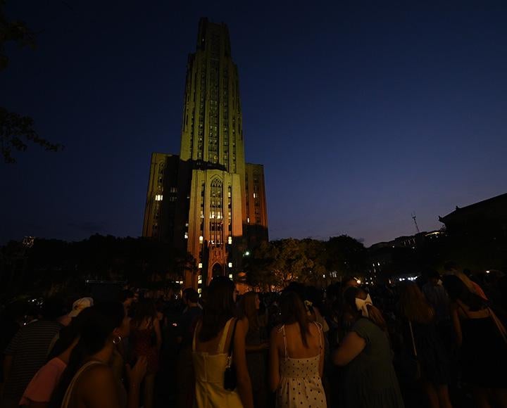 Students stand in the Cathedral Lawn during Lantern Night