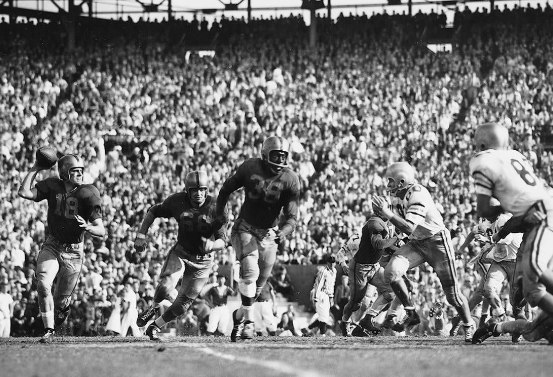 Grier and the Pitt Panthers run on the field at the 1956 Sugar Bowl