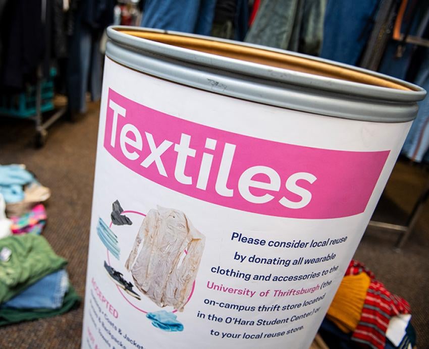 A graphic on a bin reads Textiles and shows clothing items