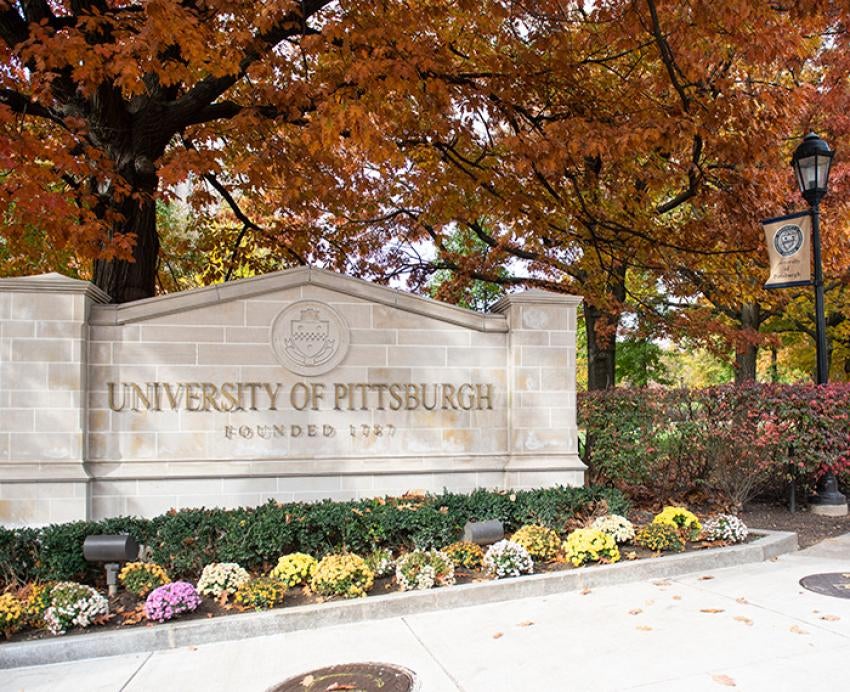 The University of Pittsburgh entrance sign on a fall day