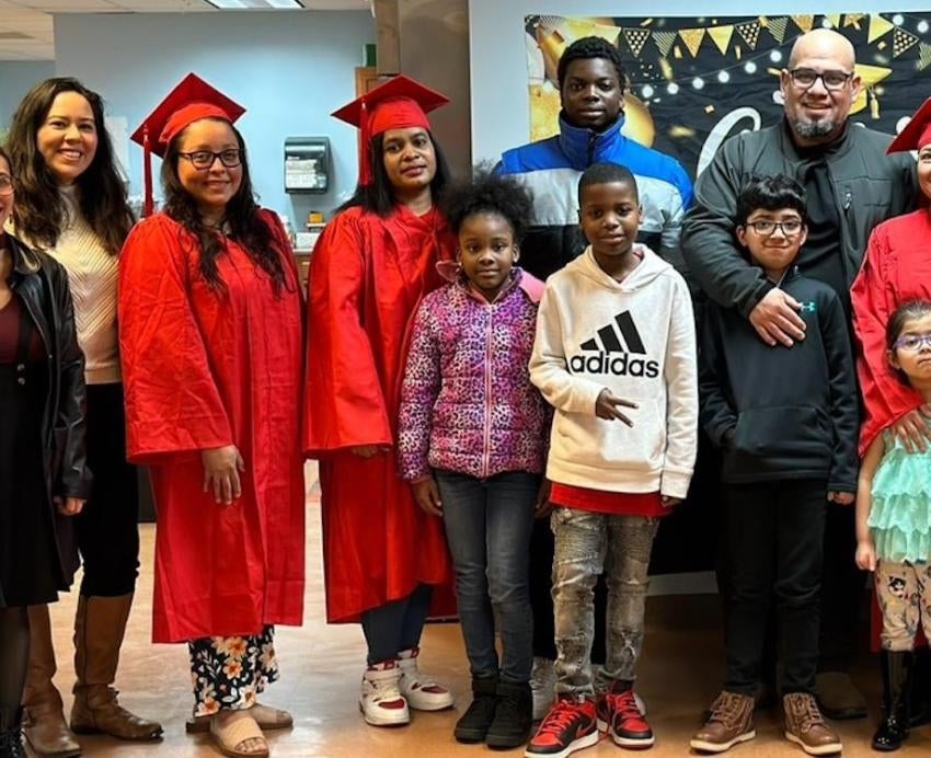 A group of adults and children posing for a photo.