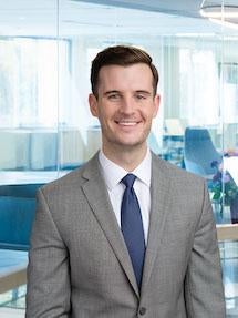 Head shot of smiling man in a suit